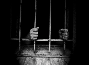 hands_on_prison_bars