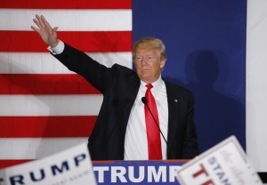 U.S. Republican presidential candidate Donald Trump waves during a campaign rally in Cedar Rapids